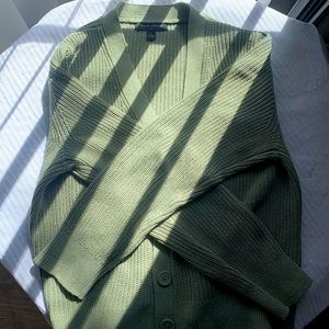 A mint green cardigan for spring season. The material is 100% cotton.